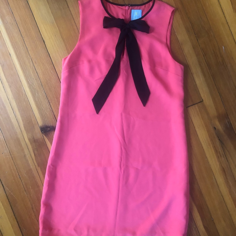 Coral with black tie dress